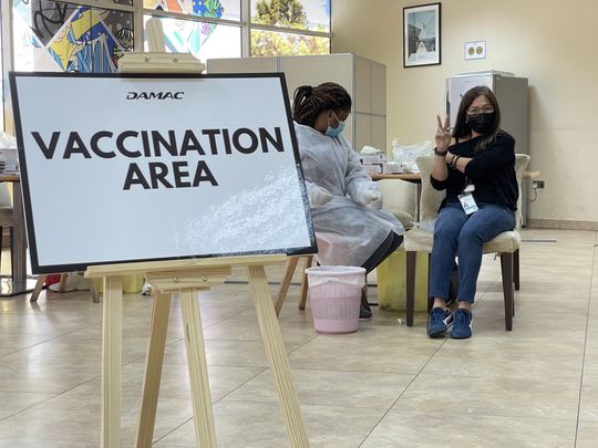 DAMAC employee receiving vaccination at DAMAC-1614500411215