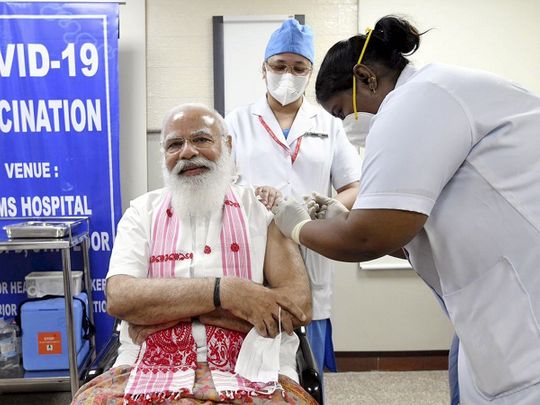 Prime Minister Narendra Modi is administered a COVID-19 vaccine at AIIMS, in New Delhi, on Monday, March 1, 2021. 