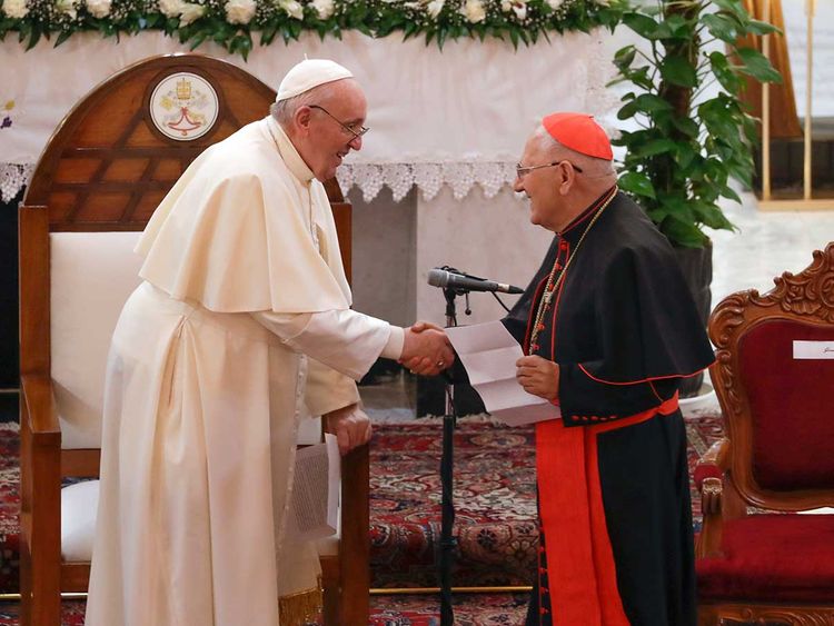 Pope Francis is welcomed by the Chaldean patriarch, Cardinal Luis Sako Iraq church