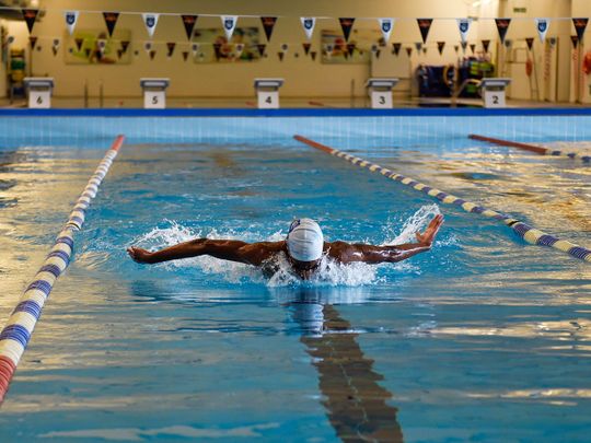 Students train at the Swimming Centre of Excellence at GEMS Wellington Academy — Al Khail