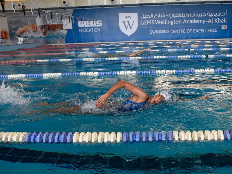 Students train at the Swimming Centre of Excellence at GEMS Wellington Academy — Al Khail