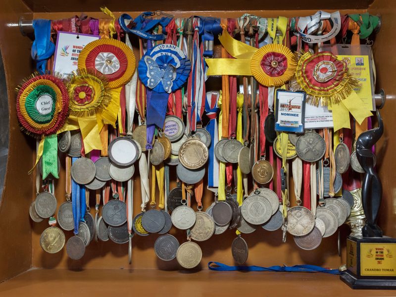 Medals and awards won at shooting competitions by Chandro Tomar, 89, at her house in the village of Johri, India.
