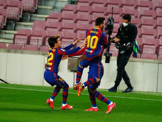 Barcelona's Ousmane Dembele celebrates with Lionel Mess after scoring against Valladolid