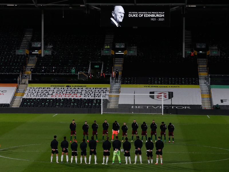 Players from both sides observe a minute's silence to honor Prince Philip, Duke of Edinburgh, before the English Premier League match between Fulham and Wolverhampton Wanderers 