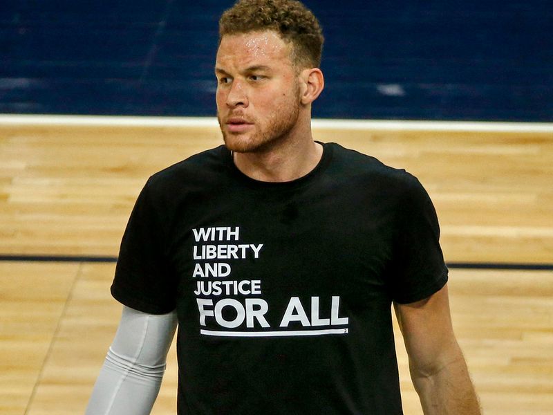 Brooklyn Nets forward Blake Griffin (2) wears a shirt that reads 'With Liberty and Justice For All' before the game against the Minnesota Timberwolves at Target Center.