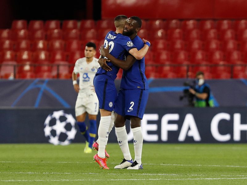 Chelsea's Antonio Rudiger (right) and Hakim Ziyech (left) embrace after the Champions League quarter final second leg match between against Porto.