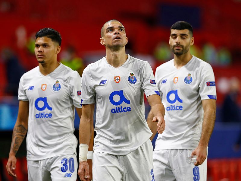 FC Porto's Evanilson, Pepe and Mehdi Taremi look dejected after the Chelsea Champions League quarterfinal.