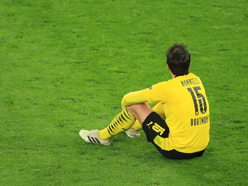 Dortmund's German defender Mats Hummels sits on the pitch after the UEFA Champions League quarter-final second leg football match between BVB Borussia Dortmund and Manchester City in Dortmund, western Germany, on April 14, 2021. (Photo by WOLFGANG RATTAY / POOL / AFP)