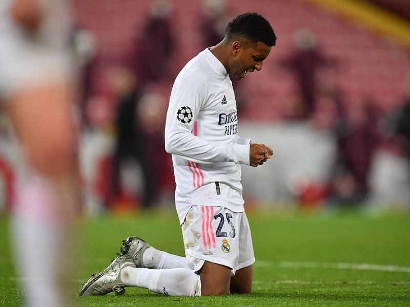 Real Madrid's Brazilian forward Rodrygo reacts at the final whistle during the UEFA Champions League quarter final second leg football match between Liverpool and Real Madrid at Anfield in Liverpool, north west England on April 14, 2021. (Photo by Paul ELLIS / AFP)