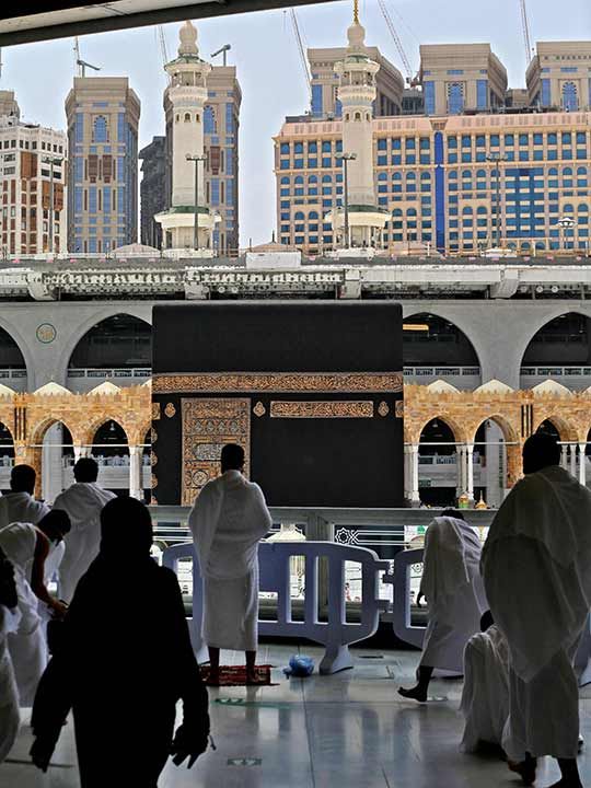 Worshippers pray inside the Grand Mosque in the Saudi holy city of Mecca, during the first Friday prayers of Ramadan, on April 16, 2021. 