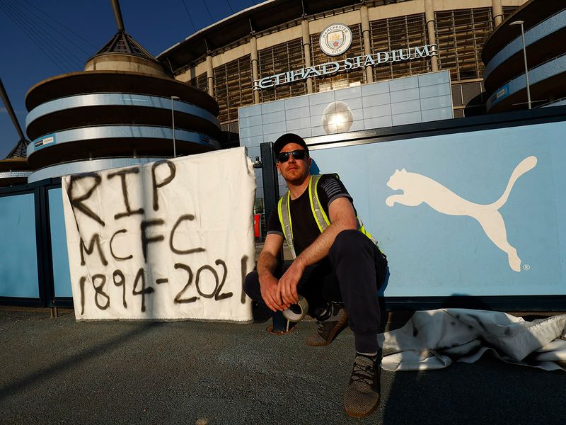 Etihad Stadium is seen as twelve of Europe's top football clubs launch a breakaway Super League. Fans protest the planned European Super League outside the stadium.