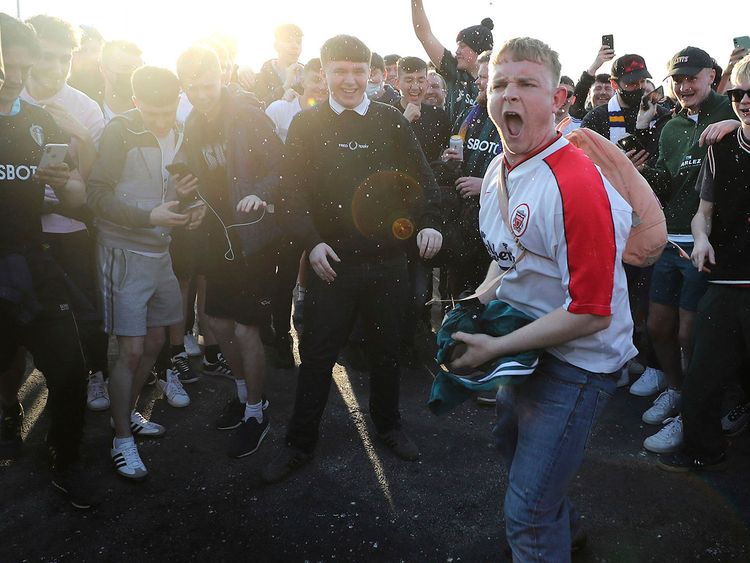 Football fans protest the European Super League.