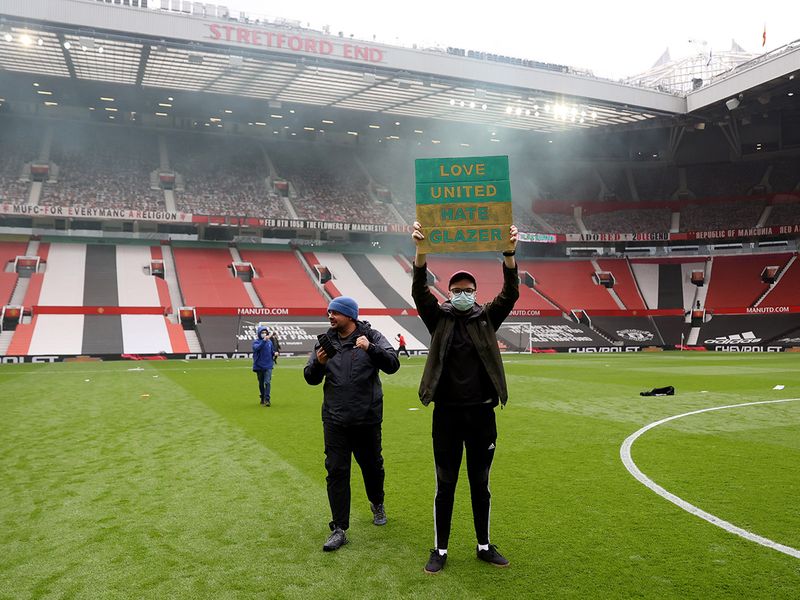 Manchester United fans protest and invade the pitch. May 2, 2021.
