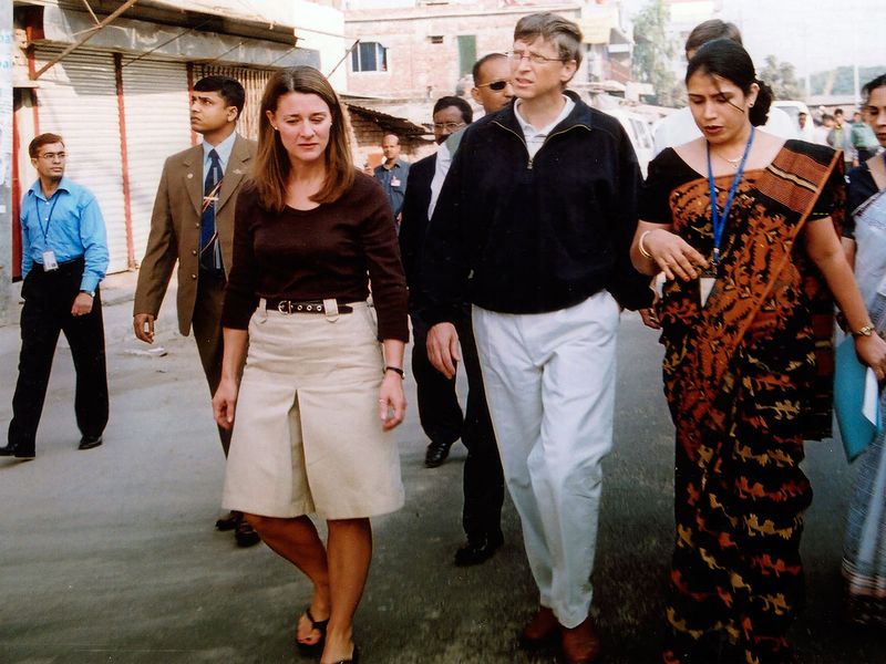 In this Dec. 5, 2005, file photo, Bill Gates, founder and chairman of Microsoft Corp., center, and his wife Melinda, left, walk on a street in Dhaka, Bangladesh. The couple announced Monday, May 3, 2021, that they are divorcing. The Microsoft co-founder and his wife, with whom he launched the world's largest charitable foundation, said they would continue to work together at The Bill & Melinda Gates Foundation. 