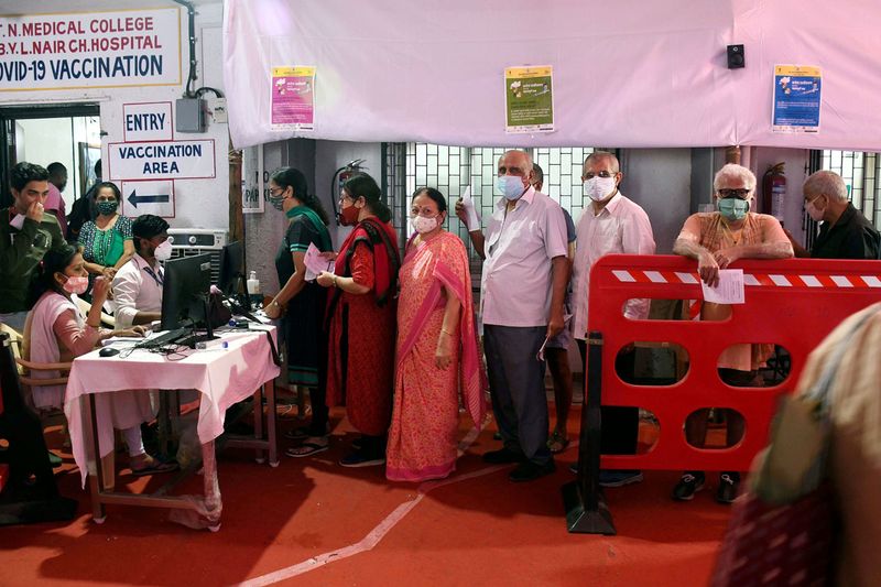  People wait in a queue to receive the dose of the Covid-19 vaccine,  at Nair hospital in Mumbai on Wednesday.