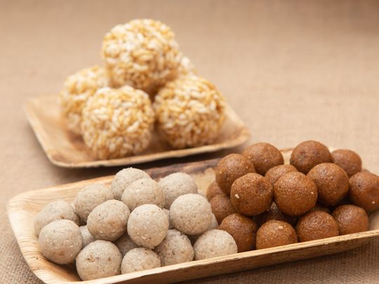 Bengali - Naru Narkel ladoos and moodhi or coconut sweet dessert and sweetened puffed rice balls