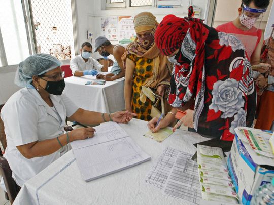 Uttar Pradesh, May 05 (ANI): A health worker administrator registered people before a COVID-19 vaccine, amidst the spread of the coronavirus disease (COVID-19), at Beli hospital in Prayagraj on Wednesday. 