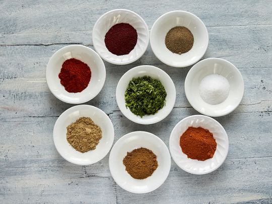 Ingredients: [clockwise] salt, chilli powder, cumin powder, coriander powder, paprika, suman, parsley, fresh mint (slide for next image)