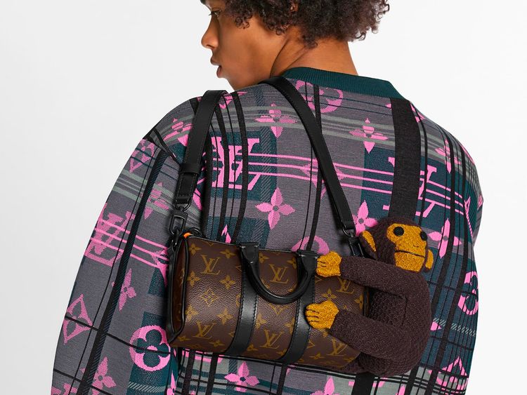 Louis Vuitton Keepall XS bag with a knit puppet