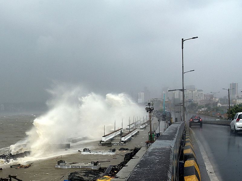 Waves lash over onto a shoreline in Mumbai on May 17, 2021, as Cyclone Tauktae, packing ferocious winds and threatening a destructive storm, surge bore down on India, disrupting the country's response to its devastating Covid-19 outbreak. 