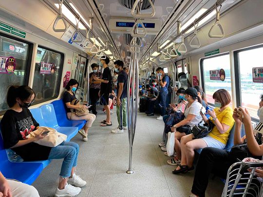 singapore commuters metro subway