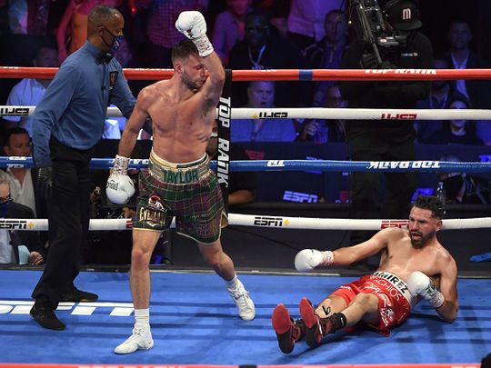 Josh Taylor reacts after knocking down Jose Ramirez during their welterweight world unification title fight at Virgin Hotels Las Vegas 