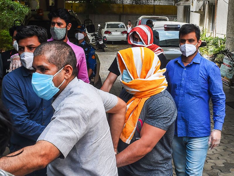 Olympics medal-winning wrestler Sushil Kumar and his associate Ajay Kumar, arrested in connection with the Chhatrasal Stadium brawl that led to the death of a wrestler, being escorted by the police at Saket Police Station, in New Delhi