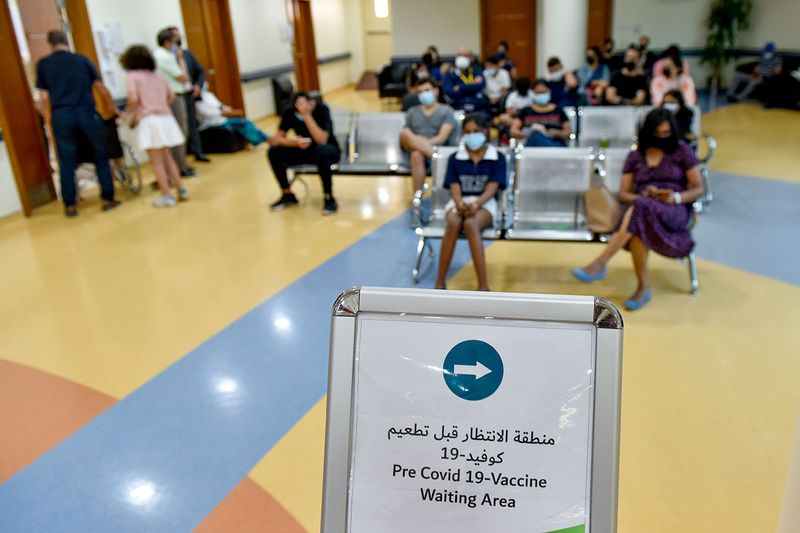Children gets vaccinated against COVID-19 at Al Barsha Health Centre in Dubai.