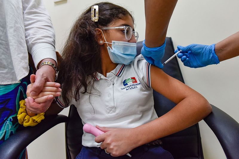Rinade Rashwan gets vaccinated against COVID-19 at Al Barsha Health Centre in Dubai. It was announed on 13th May, 2021, by the UAE’s Ministry of Health and Prevention (MOHAP) that it has approved the emergency use of the Pfizer-BioNTech vaccine for the age group of 12 to 15 year olds. 