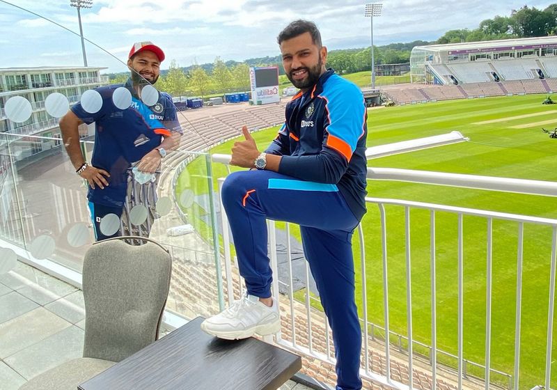 Cricketers Social distancing: Rohit Sharma and Rishabh Pant on their room balconies, albeit separated by the glass partition in Southampton. Image Credit: Twitter/Rohit Sharma