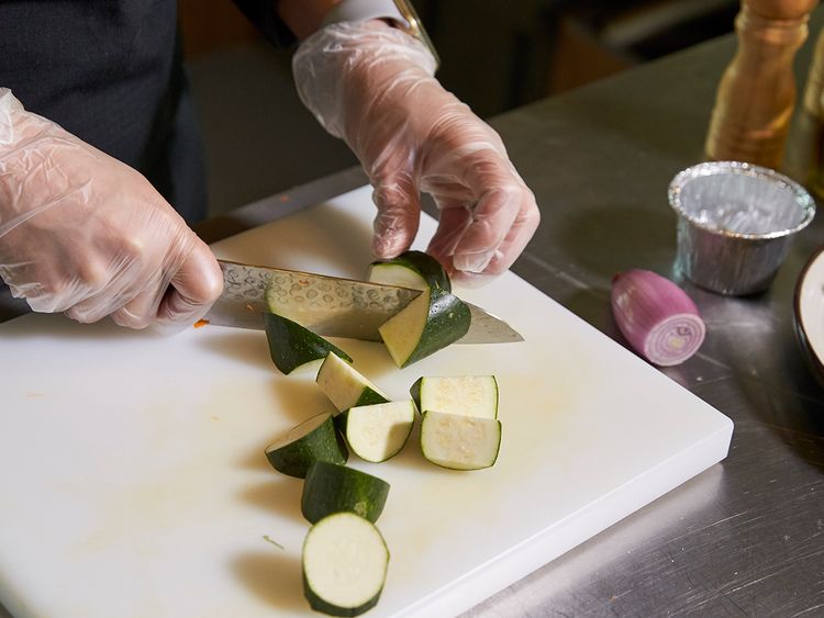 Cutting zucchini into obliques 
