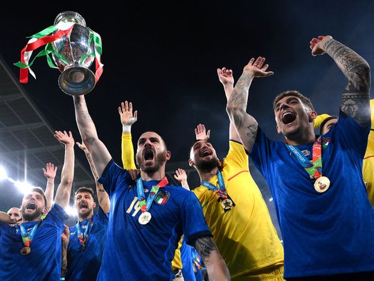 Italy's Leonardo Bonucci celebrates with the trophy after winning Euro 2020 against England at Wembley