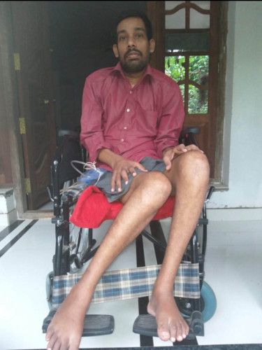 Sijish needs the help of two people to be shifted on a wheelchair-1627480583811