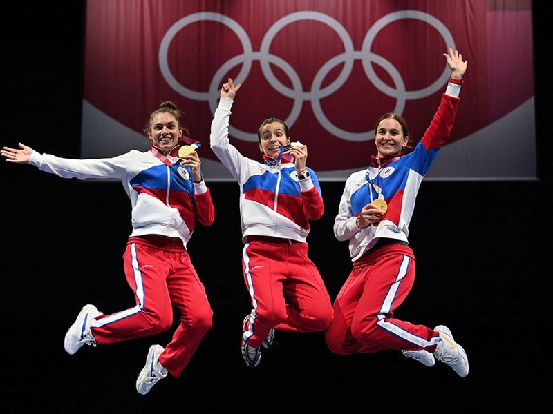 The Russian sabre team celebrate on podium in style
