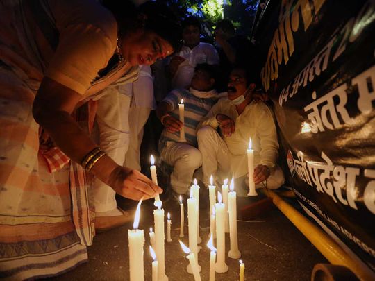 india activists rape march candles