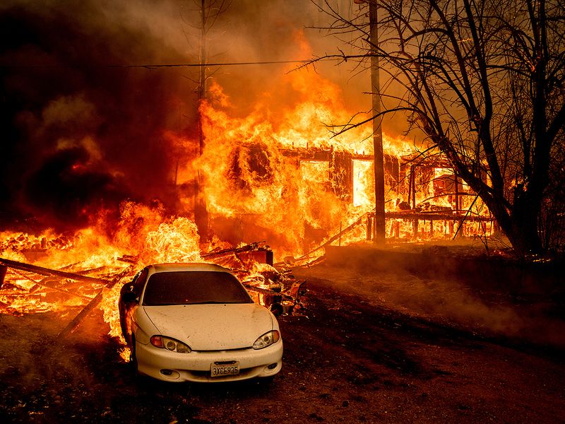 Flames from the Dixie Fire consume a home on Highway 89 south of Greenville, in Plumas County, California. 