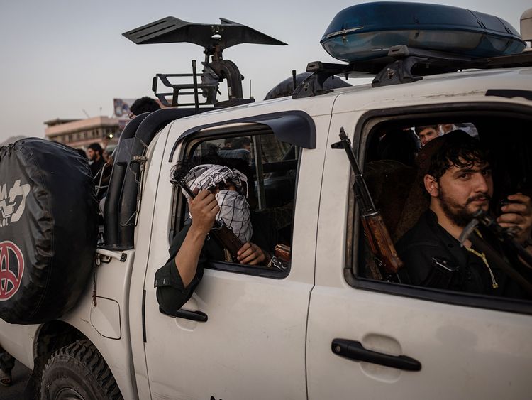 Taliban fighters drive into Kabul, on Sunday. 