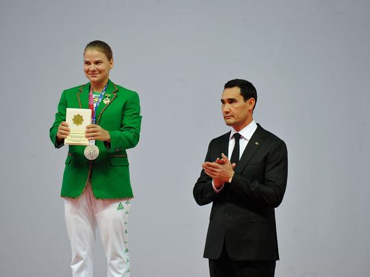 Turkmenistan's first-ever Olympic medallist, weightlifter Polina Guryeva at the presentation