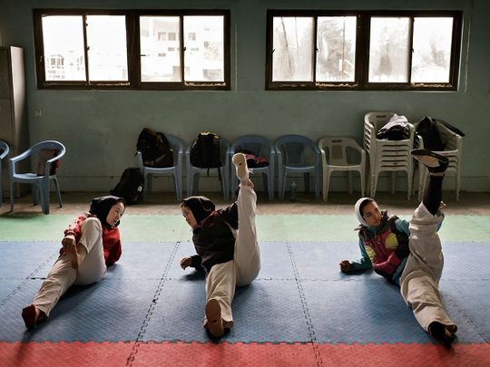 Zakia Khudadadi, left, training at the Afghan National Taekwondo Federation gym in Kabul 