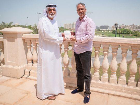 Indian golfer Jeev Milkha Singh receiving his Dubai Golden Visa from Ismail Sharif, Managing Director of Jumeirah Golf Estates.