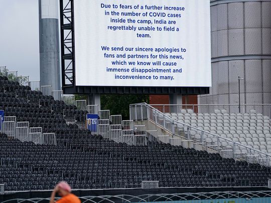 A message is displayed on a screen at Old Trafford cricket ground announces the postponement of the fifth and final Test match between England and India 