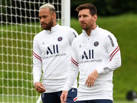 Paris Saint-Germain's Lionel Messi in training with teammate Neymar