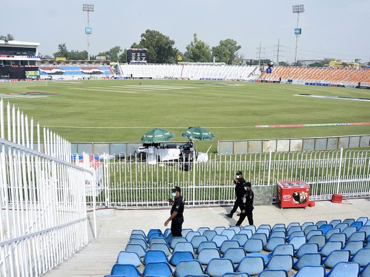 Members of the Police Elite Force walk in an enclosure at the Rawalpindi Cricket Stadium after the New Zealand cricket team pulled out of a Pakistan cricket tour over security concerns