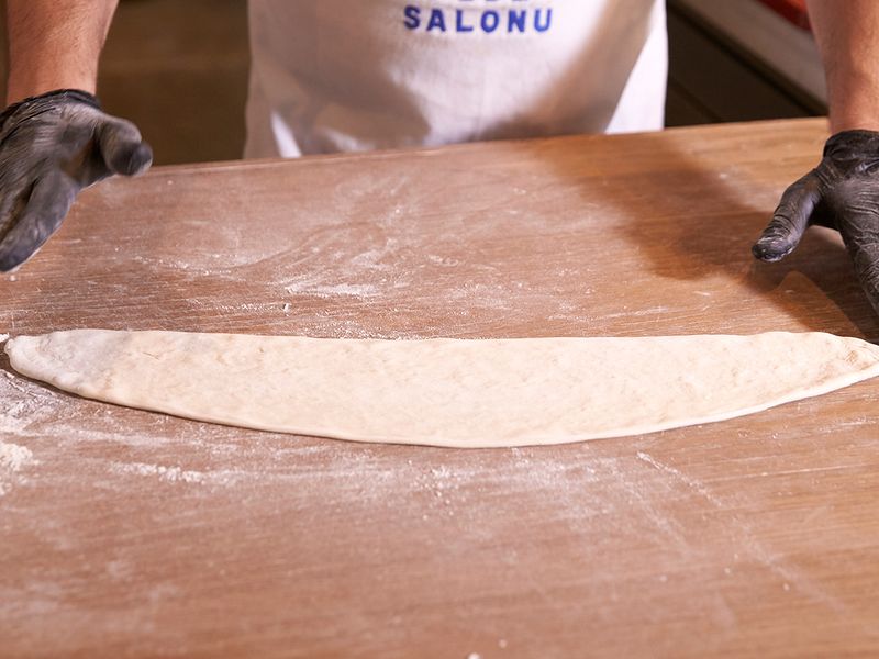 Stretch the dough into an oval shape 