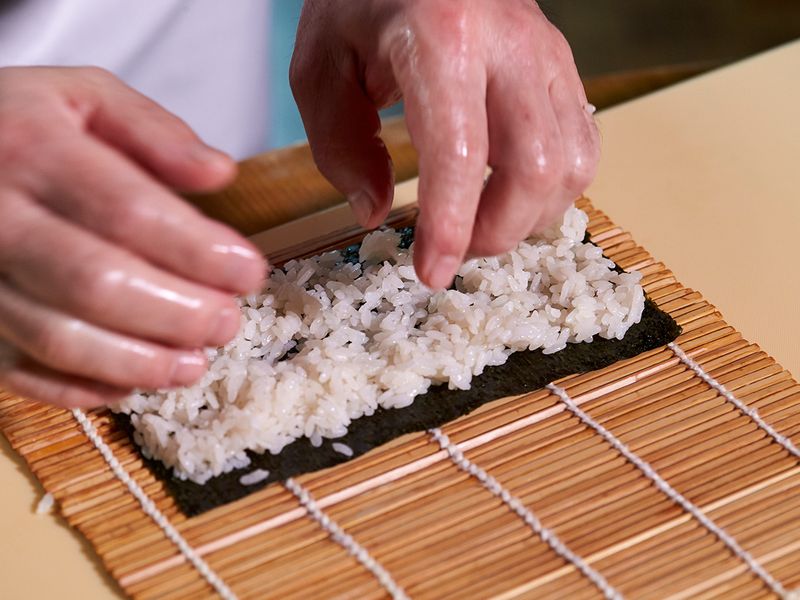 Making sushi rolls 