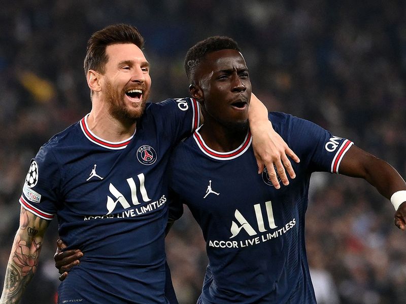 Paris Saint-Germain's Idrissa Gana Gueye celebrates with Lionel Messi