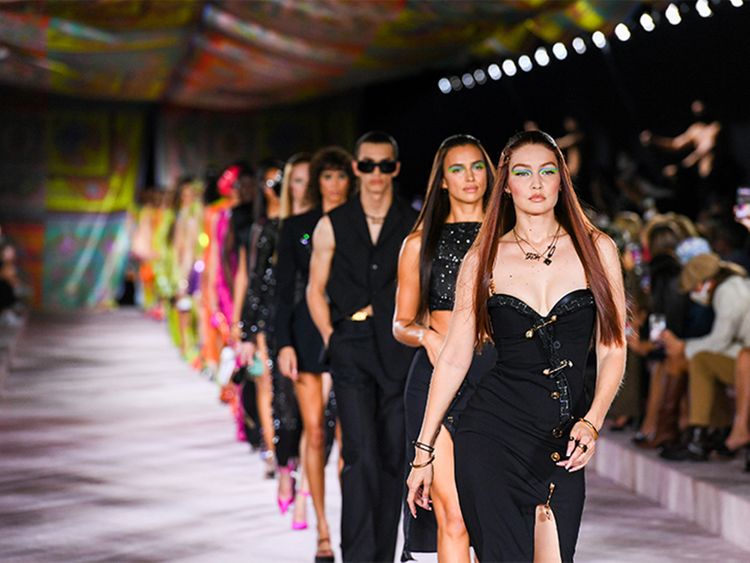 Dua Lipa illuminates Versace Fashion show