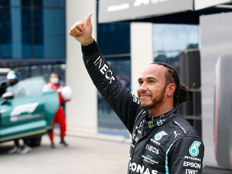 Mercedes' Lewis Hamilton celebrates his 102nd pole position