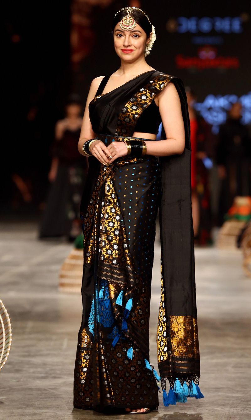 Bollywood actress Divya Khosla presents a creation by designer Sanjukta Dutta during the ‘FDCI x Lakme Fashion Week’ fashion show in Mumbai, Sunday, Oct. 10, 2021