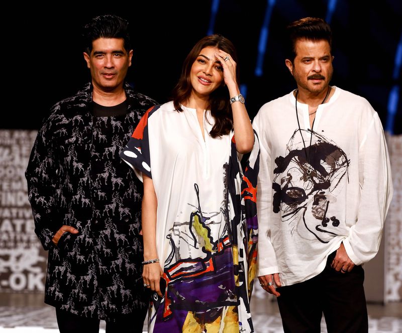 Bollywood actress Kajal Aggarwal with Anil Kapoor and Manish Malhotra at designer Anamika Khanna show during the ‘FDCI’ Lakme Fashion Week